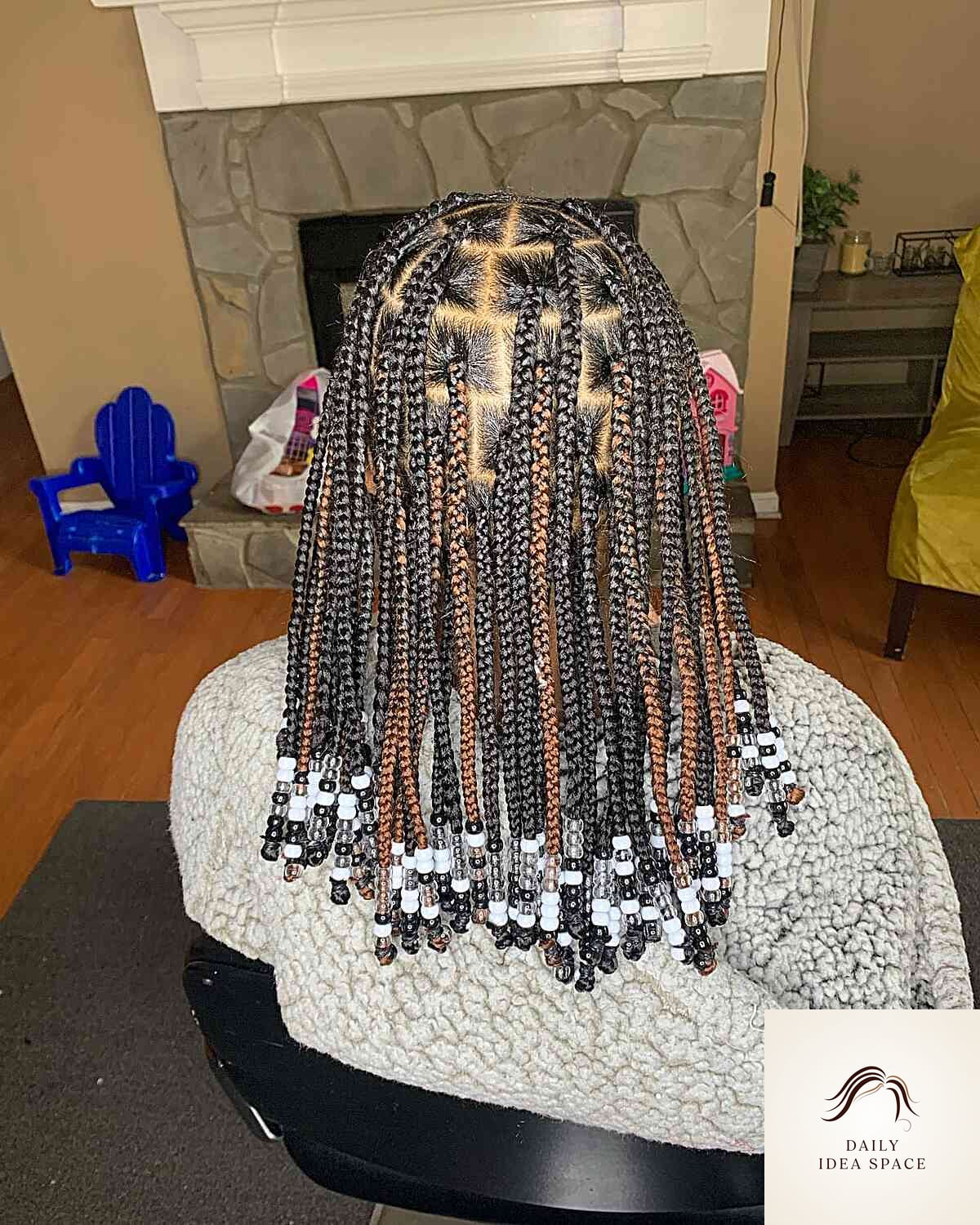 20 Braids Ideas That Are Breathtakingly Beautiful 8 Black Knotless Braids with Brown Highlights