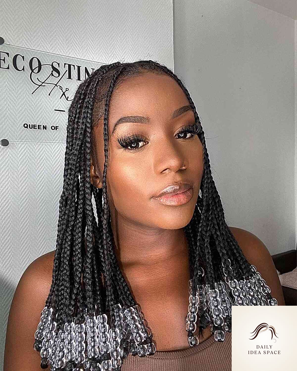 20 Braids Ideas That Are Breathtakingly Beautiful 3 Center-Parted Beaded Box Braids for Black Girls