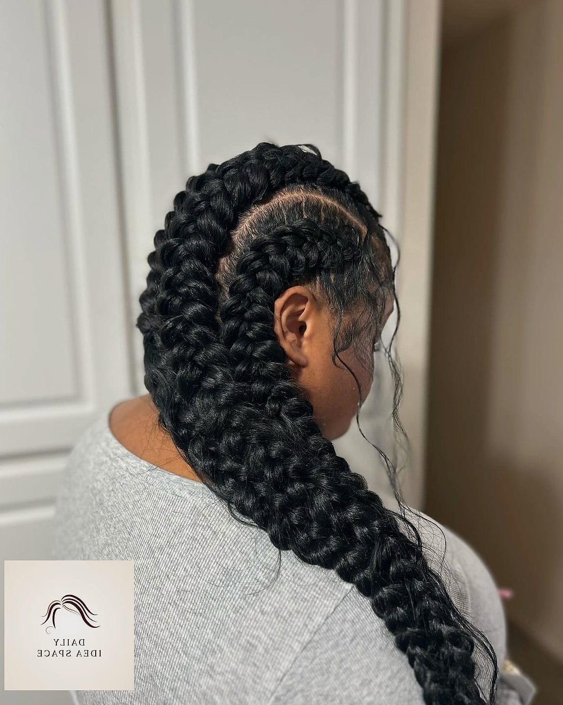 Jumbo Braids Pulled into a Low Ponytail