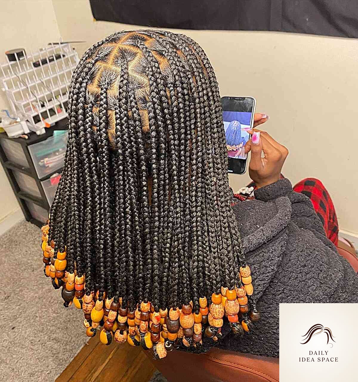 Shoulder-Length Black Braids with Orange Beads
